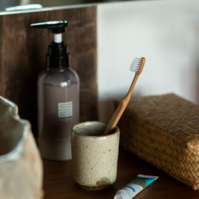 Bamboo toothbrushes made of natural resin from bamboo biomass are available for purchase as is biopaste toothpaste which is non-abrasive and made from natural ingredients.